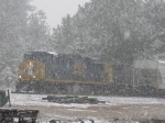 Q615 power reaches into Moncrief siding to get outbound pellet cars left by the LaGrange Switcher in a blinding wet snow.